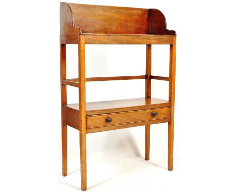 A 19th century George III mahogany book trough / hall table having a raised gallery back over a single shelf atop a drawer wi