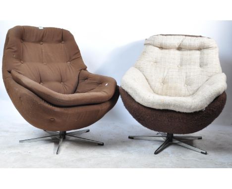 Two retro vintage circa 1960s mid 20th century egg chairs having button backs with cushioned seat raised on a chrome base. Up