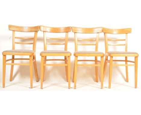 A set of four retro vintage 1950's beech dining chairs / utility side chairs having bar backs with ladder rails over pad seat