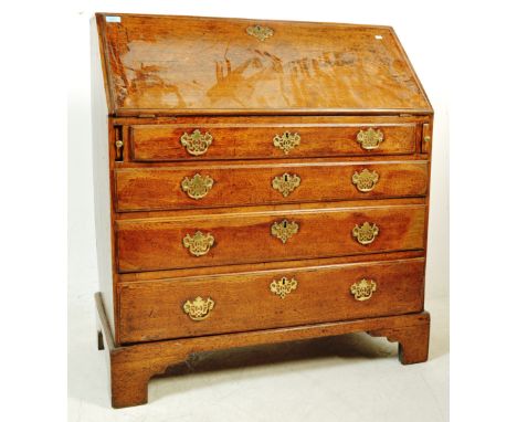 A large &nbsp;late 18th century &nbsp;George III oak bureau desk of typical form having a fall front bureau section which ope