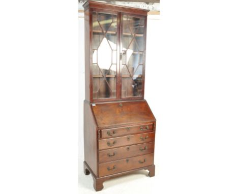 A 19th century Victorian mahogany ladies bureau bookcase having a pediment top over twin astragal glazed doors opening to rev