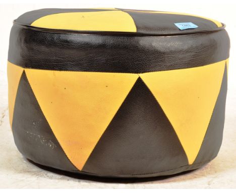 A retro vintage circa 1970s black and yellow leather footstool / pouffe of usual form having geometric decoration throughout.