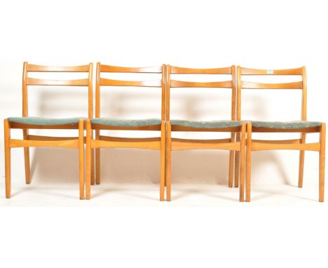 A set of four vintage retro mid 20th century circa 1960’s dining chairs. The chairs having curved later backrests, padded sea