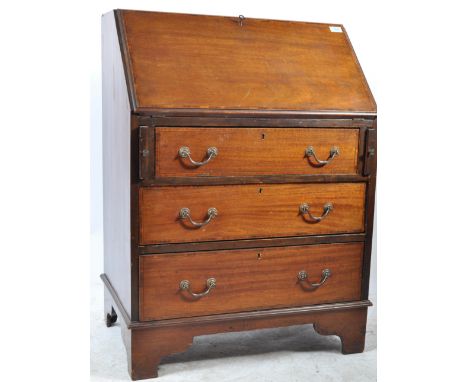 An Edwardian mahogany inlaid bureau having appointed interior with a chest of drawers to the underside raised on bracket feet