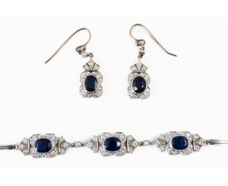 A SAPPHIRE AND DIMAOND BRACELET AND MATCHING EARRINGThe bracelet with three motifs with a central oval cut sapphire measuring