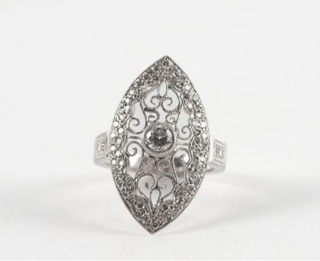 A DIAMOND SET RING, BOXEDWith marquise shaped face, set with a central round brilliant diamond with an engraved weight of 0.3
