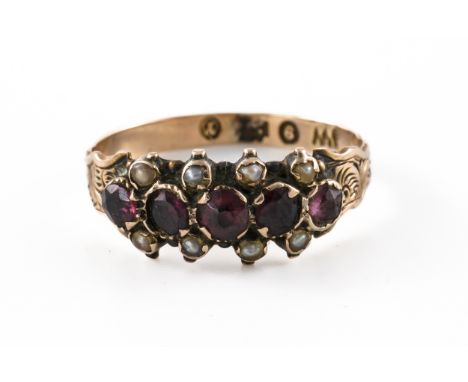 A GARNET AND PEARL RING, BOXEDWith a central row of five round cut garnets, flanked either side by seed pearls, in 9ct gold, 