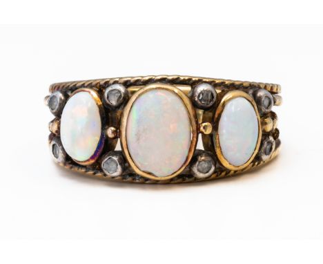 AN OPAL AND DIAMOND RINGSet with three oval cabochon opals and rose cut diamonds mounted in an openwork rope design setting, 