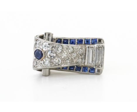 A SAPPHIRE AND DIAMOND CONTEMPORARY RINGWith scrollwork motif set with single and baguette cut diamonds, with round and squar