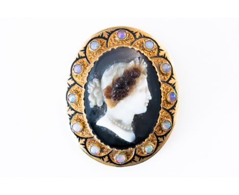 A BANDED AGATE OPAL AND ENAMELLED CAMEO BROOCHThe carved hardstone cameo depicting the profile of a lady, in a gold surround,