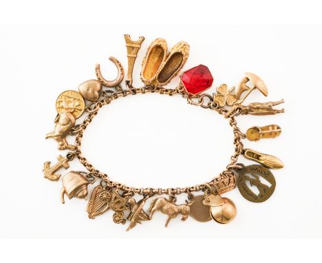 A BELCHER LINK CHARM BRACELETIn 9ct with a higher wash, set with 22 mostly 9ct charms including an anchor, a clover, a shoe, 
