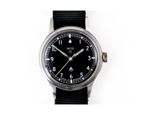 A STEEL CASED SMITHS 1967 MILITARY WRISTWATCHThe black dial signed Smiths, with the military arrow and circled T, with white 