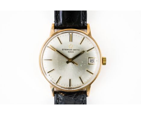 AN ETERNA-MATIC GENTLEMAN'S WRISTWATCHThe silvered dial signed Eterna-Matic 1000, with baton hour markers, and date at three,