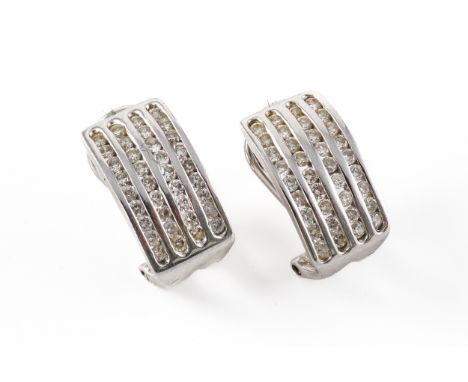 A PAIR OF DIAMOND EARRINGS, BOXEDOf half hoop design, channel set with four vertical rows of round brilliant diamonds, mounte