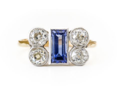 A SAPPHIRE AND DIAMOND RINGWith a central baguette cut sapphire, flanked either side by two old cut diamonds, with an estimat