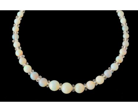 AN OPAL BEAD AND ROCK CRYSTAL NECKLACEWith graduating opal beads measuring from 4mm to 9.9mm in diameter, each separated by a