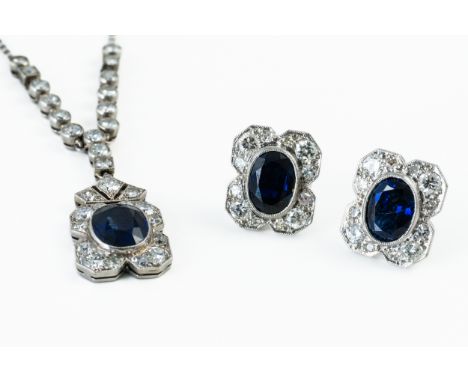 A SAPPHIRE DIAMOND AND NECKLACE AND MATCHING STUDSThe necklace with a central oval cut sapphire measuring 7.6mm x 6.3mm, with