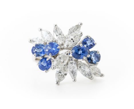 A SAPPHIRE AND DIAMOND SPRAY RINGMounted with ten marquise cut diamonds and six round cut sapphires in a contemporary spray d