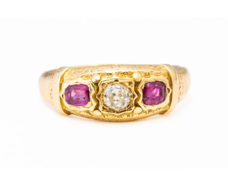 A RUBY AND DIAMOND RINGWith central old cut diamond flanked either side by emerald cut rubies, mounted in 14ct yellow gold, h