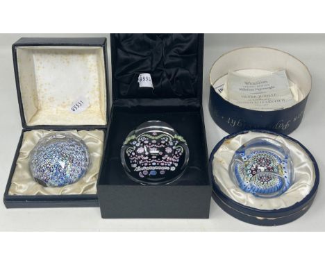 A Whitefriars commemorative glass paperweight, boxed, and two other glass paperweights (3)