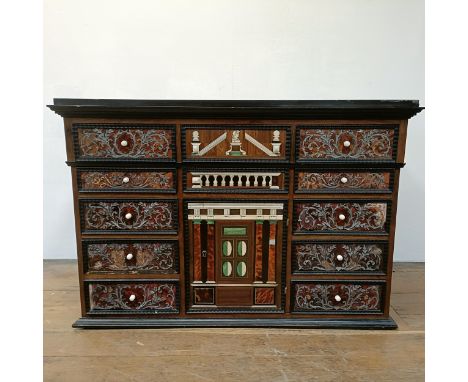 An 18th century Italian collector’s cabinet, with geometric and other inlaid decoration, the arrangement of ten Boulle work d