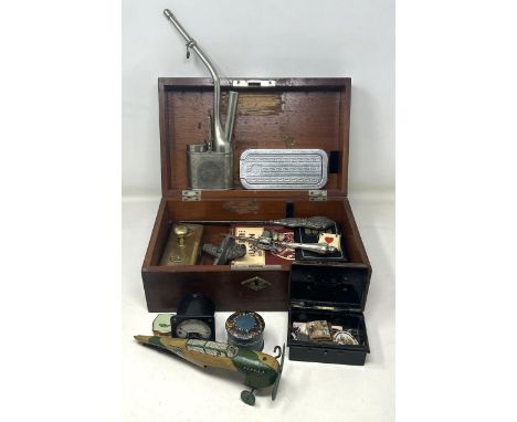 A Chinese silver plated pipe, and other items, in a mahogany box