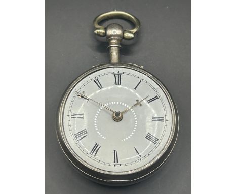 A George IV silver pocket watch, with and enamel dial, and a fusee movement, signed John Wynstanley, London 1822, 5 cm diamet