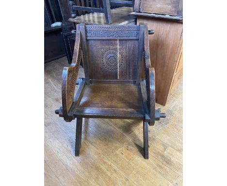 A Glastonbury oak armchair, and other chairs