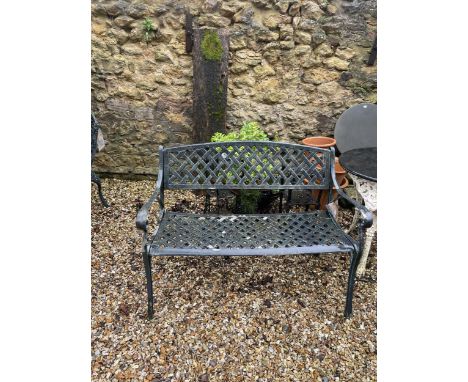 A painted metal garden bench, 117 cm wide, a pair of pot stands, and a metal garden urn with plants