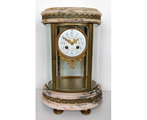 A late 19th/early 20th century oval clock, the 9 cm diameter enamel dial signed Mandella, Camors, fitted an eight day movemen