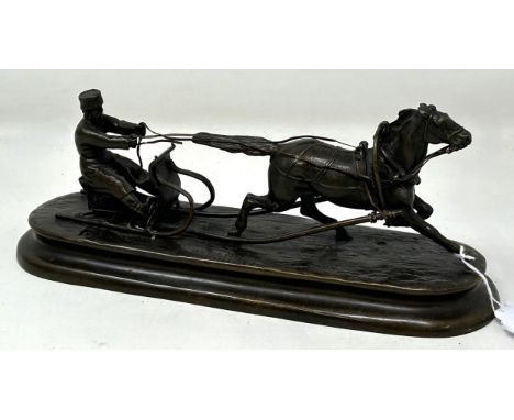 A bronze group of a Russian in a sleigh, being pulled by a horse, 23 cm wide