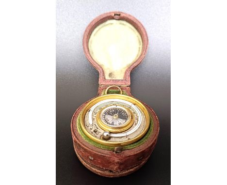 A late 19th/early 20th century pocket combined barometer, thermometer and compass, in a leather case