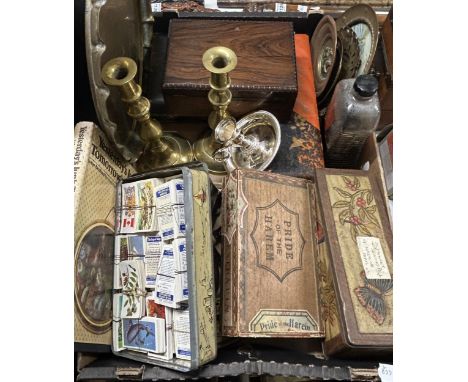 A pair of brass candlesticks, assorted cigarette cards, and other items (box)