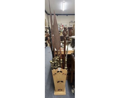 A stick stand, an African carved wood leaf paddle, and other items