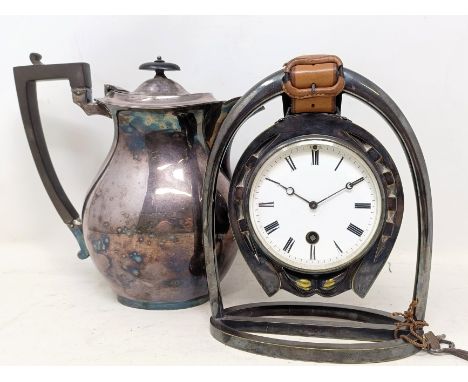 A novelty silver plated mantel clock, in the form of a stirrup and a horseshoe, with a single train eight day movement, 22 cm