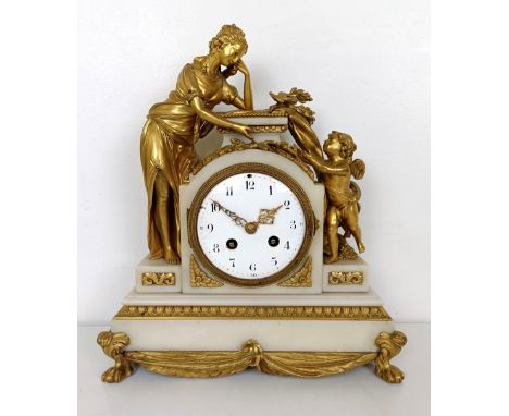 A late 19th century mantel clock, the enamel dial fitted an eight day movement striking on a bell, in a marble and ormolu cas