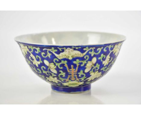 A Chinese porcelain blue ground lotus bowl, bears red seal mark to base, diameter 12.5cm.Condition Report: areas of loss to t