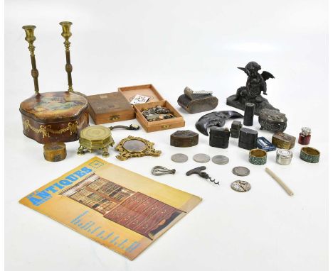 An assortment of collectors' items including a pair of brass candlesticks, a Victorian easel back photograph frame set with p