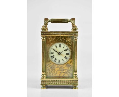 A brass cased carriage clock, with white enamel dial set with Roman numerals, height 14cm.