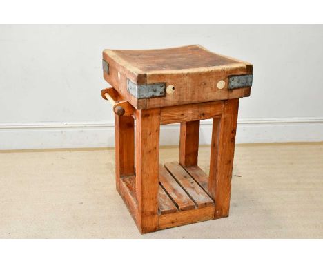 A vintage metal bound butcher's block on pine stand, height 89cm, width 62cm. 