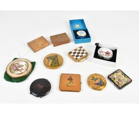 A collection eleven of vintage compacts.