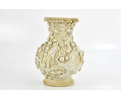 A Chinese Dehua vase of baluster form, decorated with birds perching and various roundels, with impressed Qianlong seal mark 