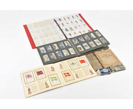 A collection of cigarette cards, sets including Railway Equipment, Ceremonial and Court Dress, Army Life, Riders of the World