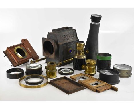 A vintage projector with Elite Optics High Wycombe projection lens, additional lenses and accessories (qty).
