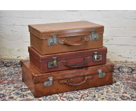 Three vintage suitcases including two leather examples, the largest with intials 'F.S', width 66cm (3).
