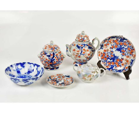 An early 20th century Japanese Imari decorated four piece part tea service comprising teapot, twin handled lidded sugar bowl,
