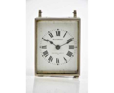 WILLIAMS &amp; CO; a travelling clock with white enamel dial set with Roman numerals, height 8cm.