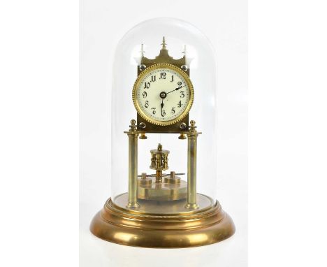 An early 20th century brass anniversary clock, with white enamel dial set with Arabic numerals, height 28cm. 
