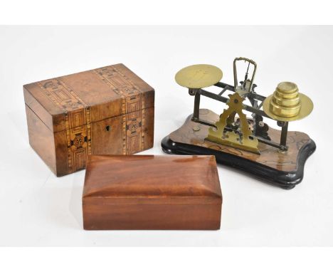 A Victorian inlaid mahogany tea caddy, a mahogany work box and a set of Victorian balance scales with weights (3). 