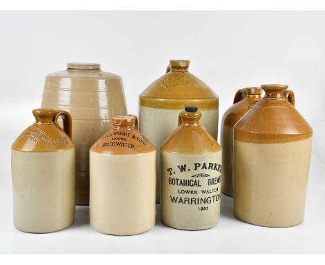 Seven stoneware flagons including advertising examples C &amp; R Brown Wine &amp; Spirit Merchants Middlewich, Starkey, Knigh